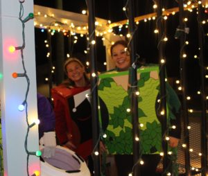 Two of our supervillains in our parade float Christmas jail